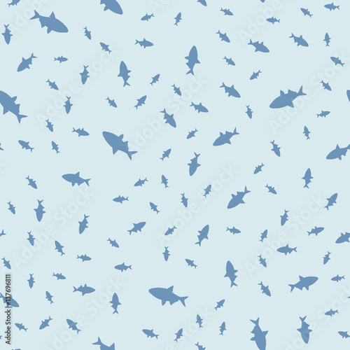 Seamless pattern of fish in different sizes  floating in a chaotic manner. Vector illustration.