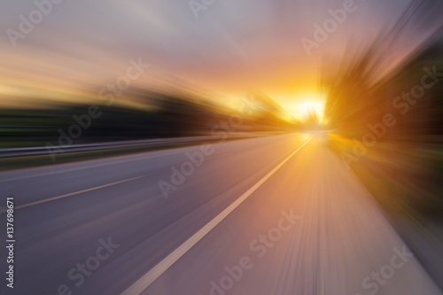 Abstract motion blur of the road and sunset