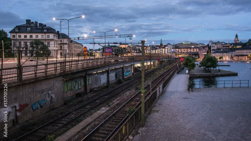 Time Lapse of city railroad tracks at night. Traffic passing by over bridge Time Lapse of city railroad tracks at night. Traffic passing by over bridge