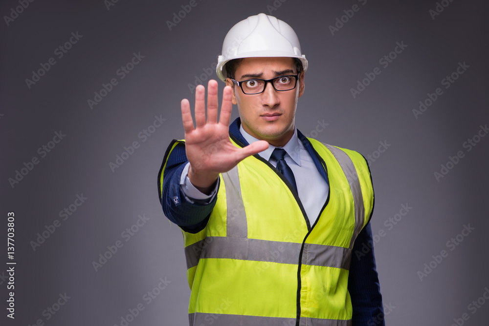 Man wearing hard hat and construction vest Man wearing hard hat and construction vest