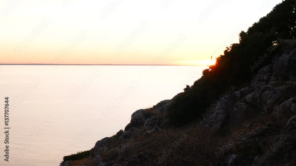 Nature reserve landscape at sunset. Land formation and sea Nature reserve landscape at sunset. Land formation and sea