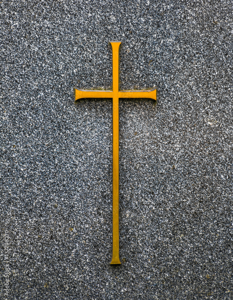 Kreuzsymbol auf Grabstein