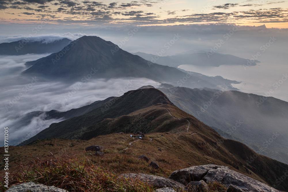 Scenic view of mountains and coastline from the Lantau Peak (the second highest peak in Hong Kong, China (934m)) at dawn.