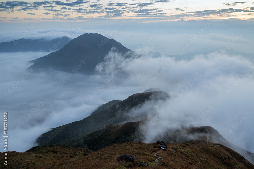 Cloudy view from the Lantau Peak (the second highest peak in Hong Kong, China (934m)) at dawn.