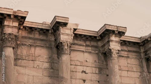 Greek columns of the library of hadrian at Monastiraki of Athens at dusk photo