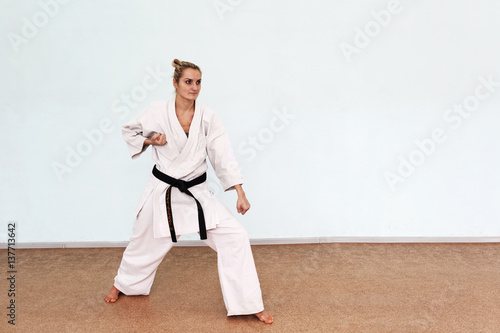 The girl in a white kimono plays sports