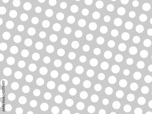 Abstract geometric pattern of white circle dots in various sizes on grey background. Modern stylish vector design element.