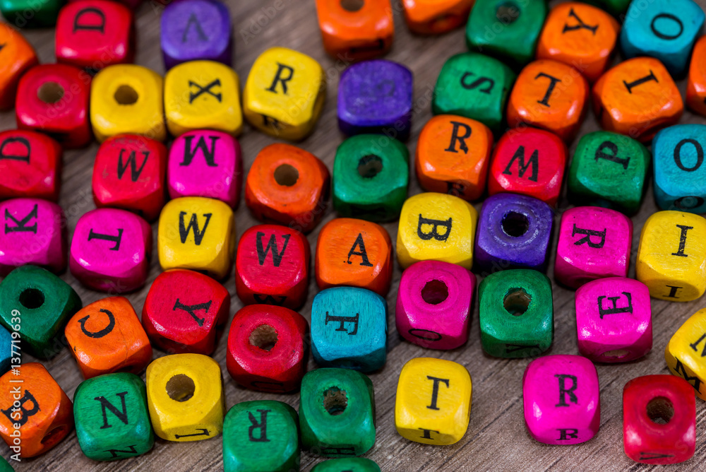 some colored cubes with letters, sign with wooden cubes some colored cubes with letters, sign with wooden cubes