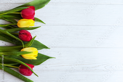 Wooden white background with tulips. Conception holiday, March 8, Mother's Day.