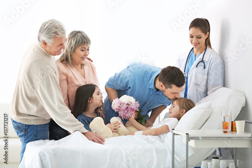 Family visiting little girl...