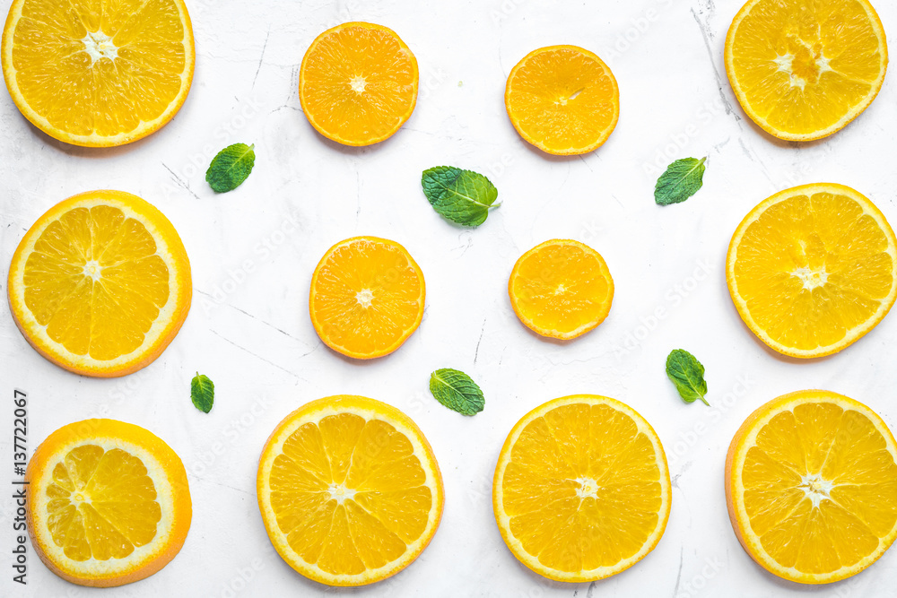 Orange slices with mint on white background top view pattern