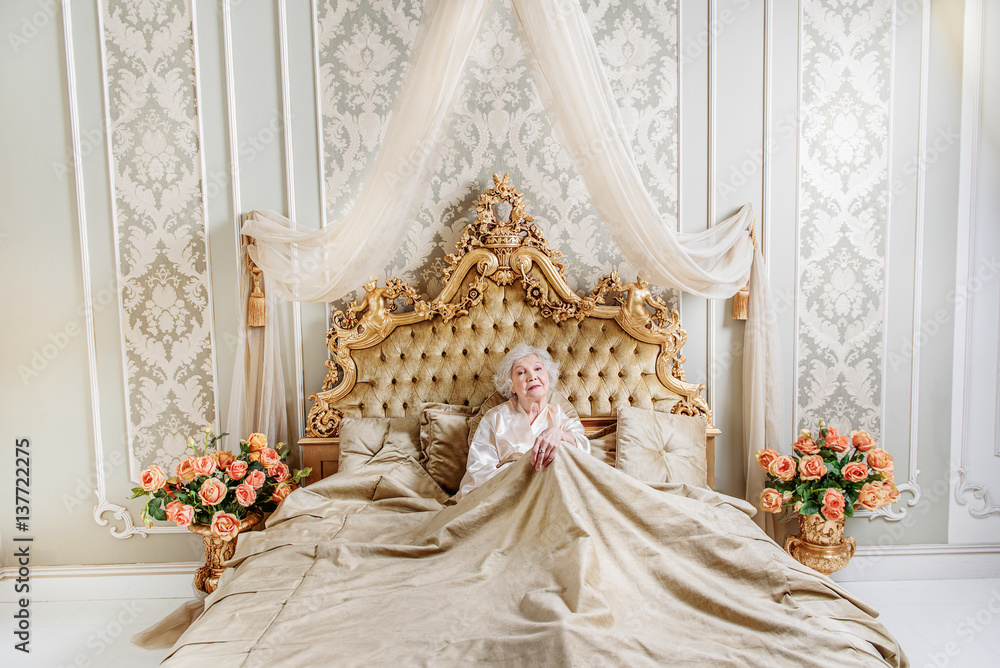 Fototapeta premium Alone senior queen resting in bedroom