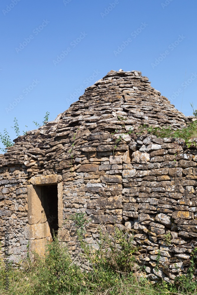 Old and typical stone hut in the vineyards of Beaujolais, France 