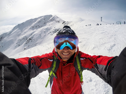Selfie of skier on the top of the mountain