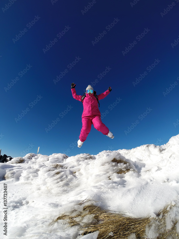 Skier in jump on the top of mountain.