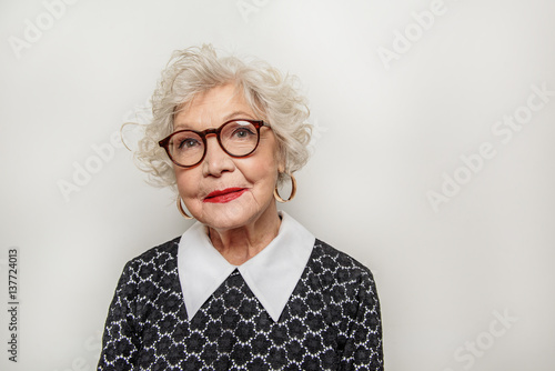 Dreamful old lady expressing positive emotions