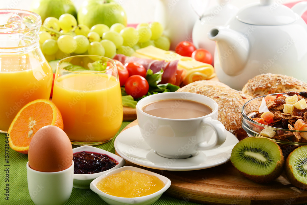 Breakfast served with coffee, orange juice, egg and fruits Breakfast served with coffee, orange juice, egg and fruits