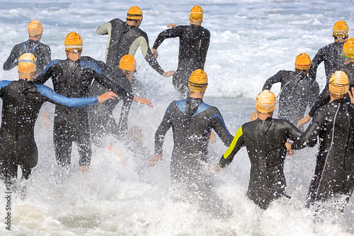 Fotografie triathlon participants in triathlon in swimming  race