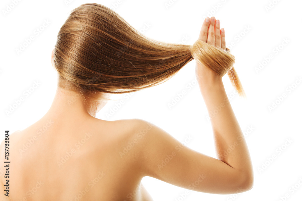 Naklejka premium Long blond human hair close-up.