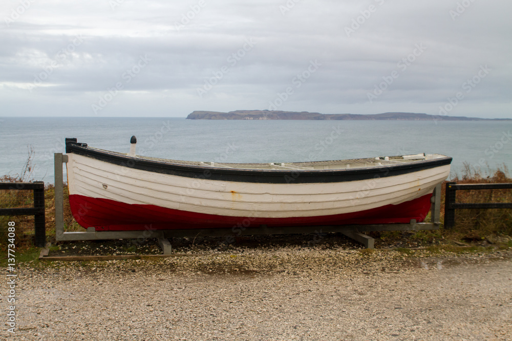 Naklejka premium Carrick-a-Rede Rope Bridge, near Ballintoy in County Antrim, Northern Ireland, believed to been built by salmon fishermen to the island for over 350 years
