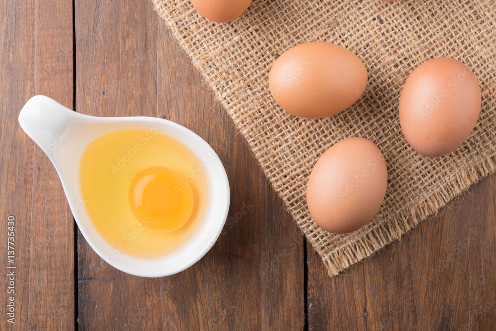 Fresh eggs on wood background. Top view Fresh eggs on wood background. Top view