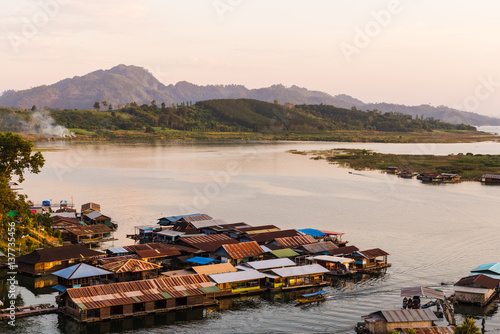 Sangkhlaburi village antique bridge landmark traditional culture in dam lake, kanchanaburi, Thailand photo