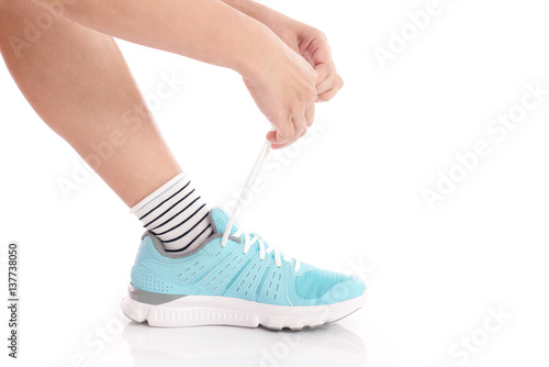  woman tying shoelaces