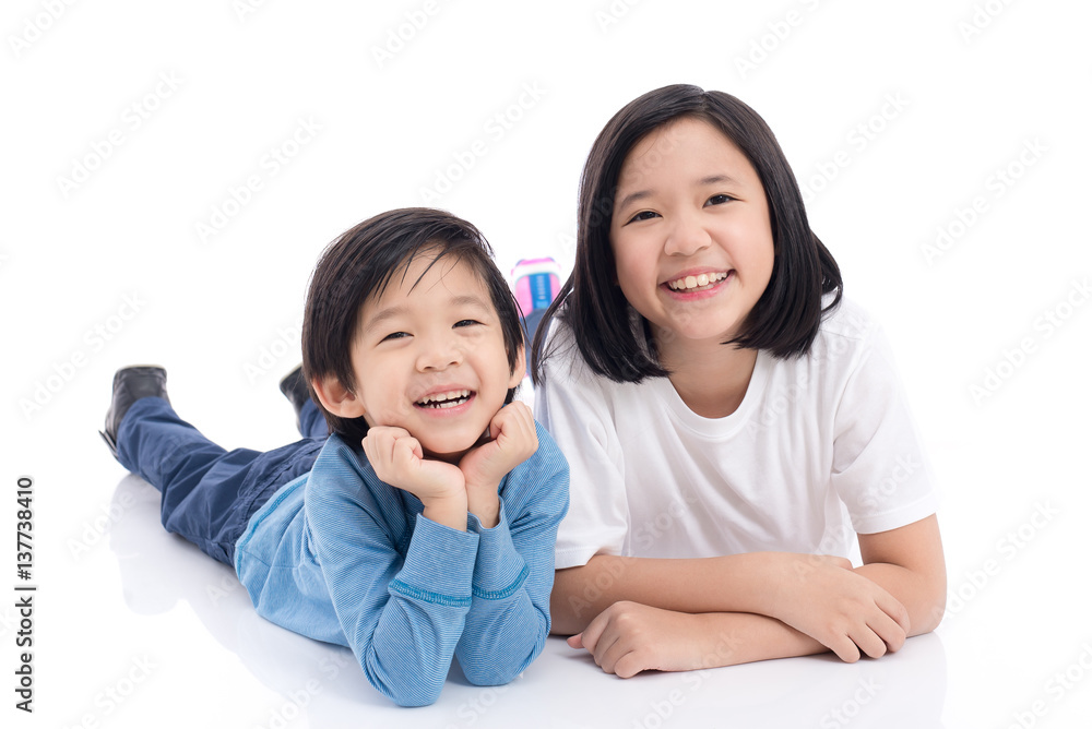 Asian children lying on white background isolated Asian children lying on white background isolated