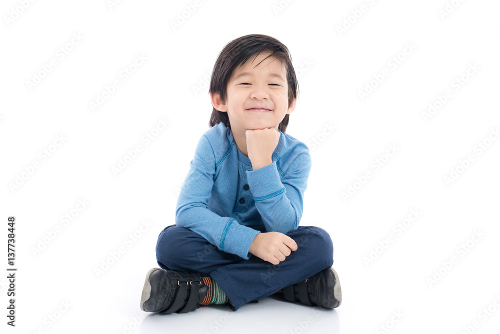 asian boy sitting on white background asian boy sitting on white background