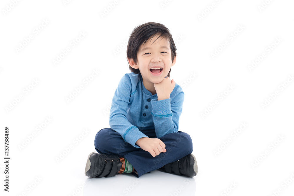 asian boy sitting on white background asian boy sitting on white background