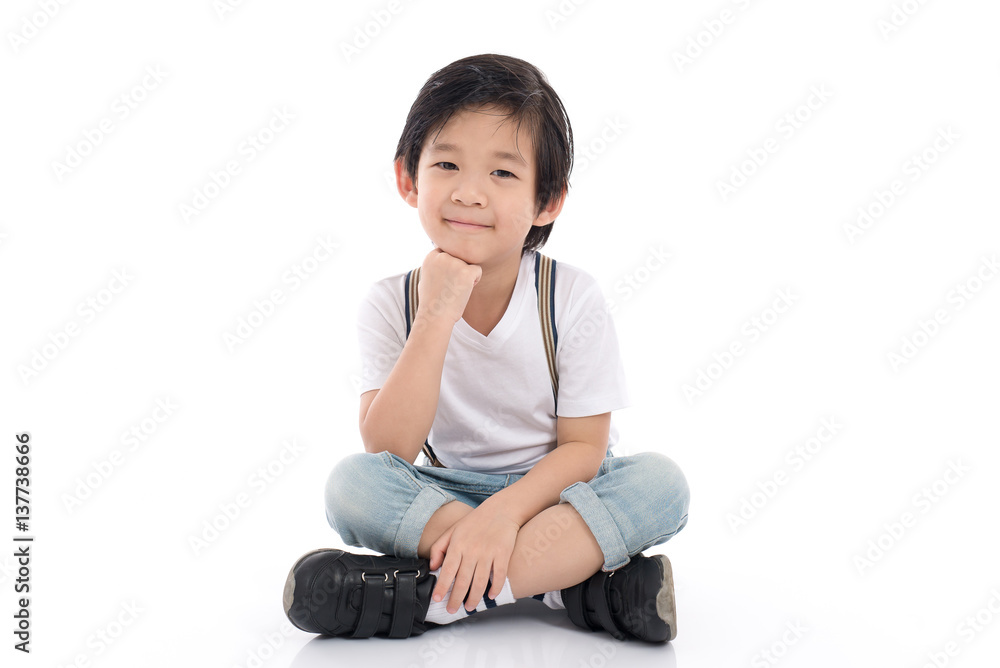 asian boy sitting on white background asian boy sitting on white background