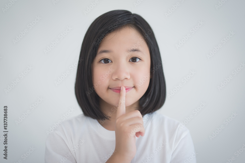 beautiful Adsian girl with a finger on her lips beautiful Adsian girl with a finger on her lips