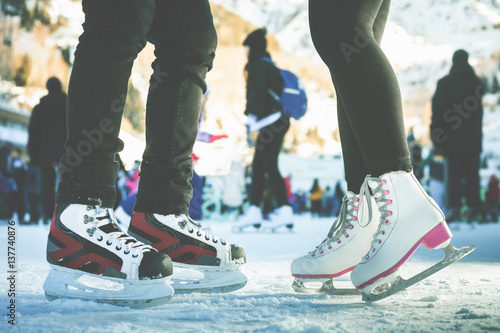Obraz na plátně Closeup skating shoes ice skating outdoor at ice rink