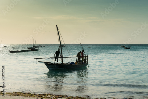 people near wooden fishing ship