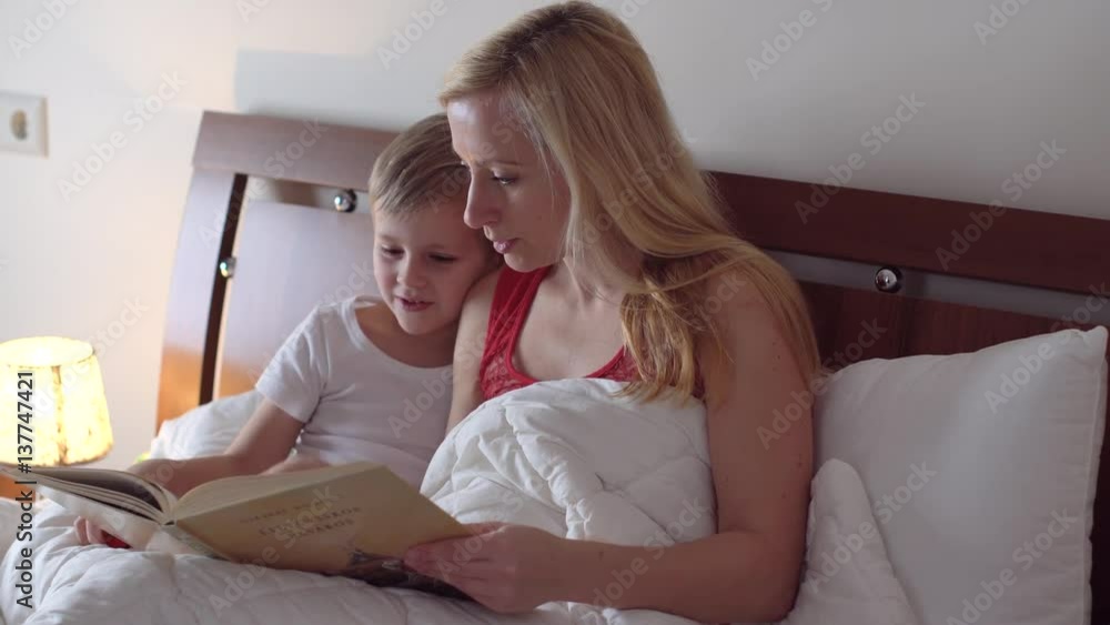 mom with kid reading book