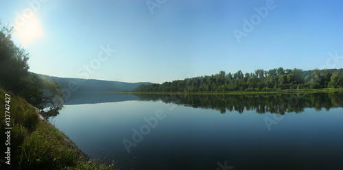 Panorama of the river with calm water © Aleksandr