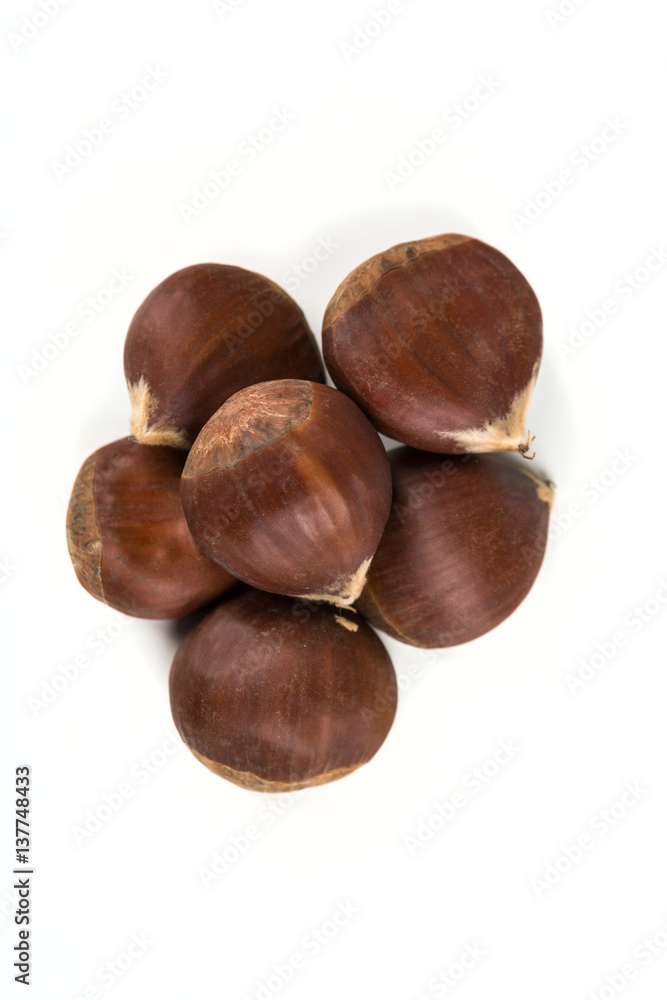 Raw organic chestnuts isolated on a white background Raw organic chestnuts isolated on a white background