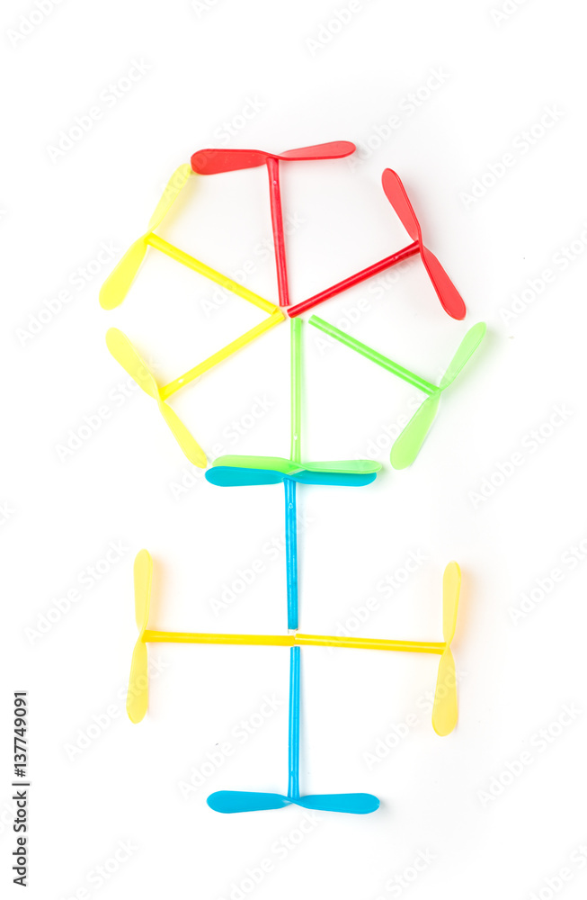 Plastic toy spinners in a flower pattern isolated on a white background Plastic toy spinners in a flower pattern isolated on a white background