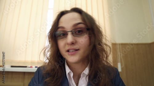 Strict boss, the evil headmistress in glasses gives orders
