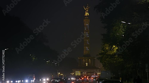 Berlin Monument Victory Column at night, light projection Festival of Lights traffic , TV Tower in the background,  photo