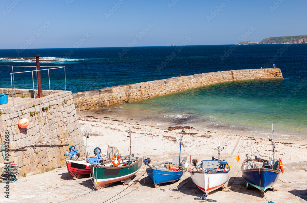 Boats in Sennen Cove Harbour Cornwall on a fine summers day
