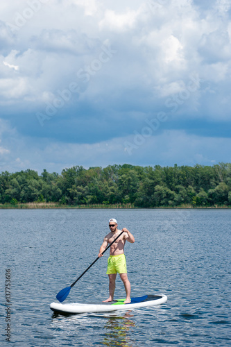 man practicing paddle board 04