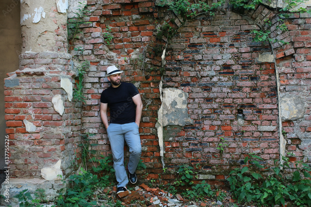 old brick wall man stand old brick wall man stand