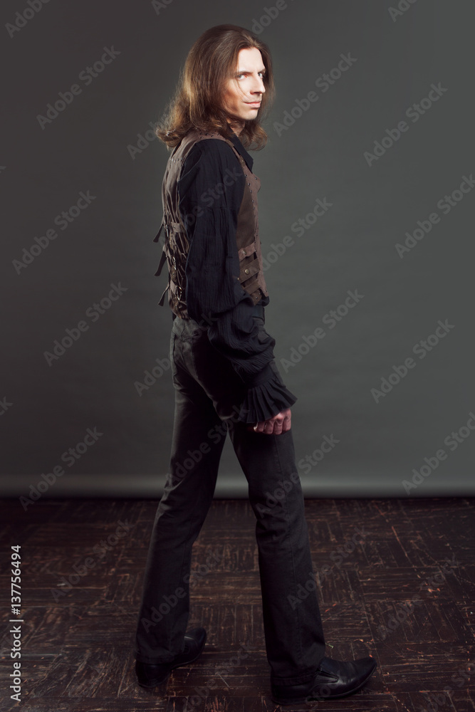 Retro man portrait over grunge background. Steam punk style. Retro man portrait over grunge background. Steam punk style.