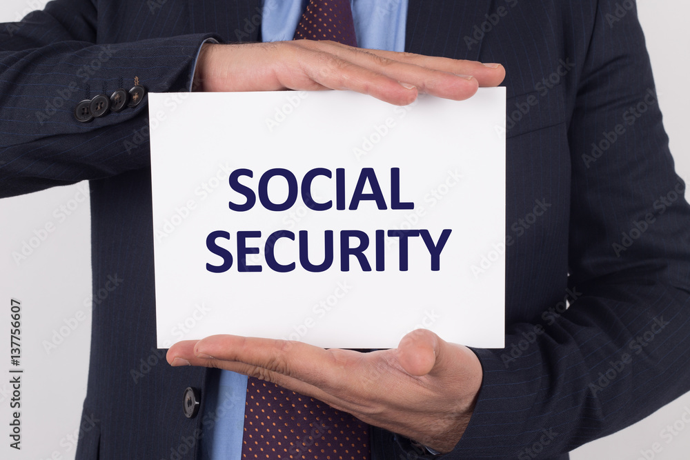 Man showing paper with SOCIAL SECURITY text Man showing paper with SOCIAL SECURITY text