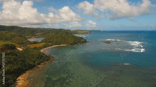 Wallpaper Mural The coast of the tropical island with the mountains and the rainforest on a background of ocean with big waves.Aerial view: sea and the tropical island with rocks, beach and waves. Seascape: sky Torontodigital.ca