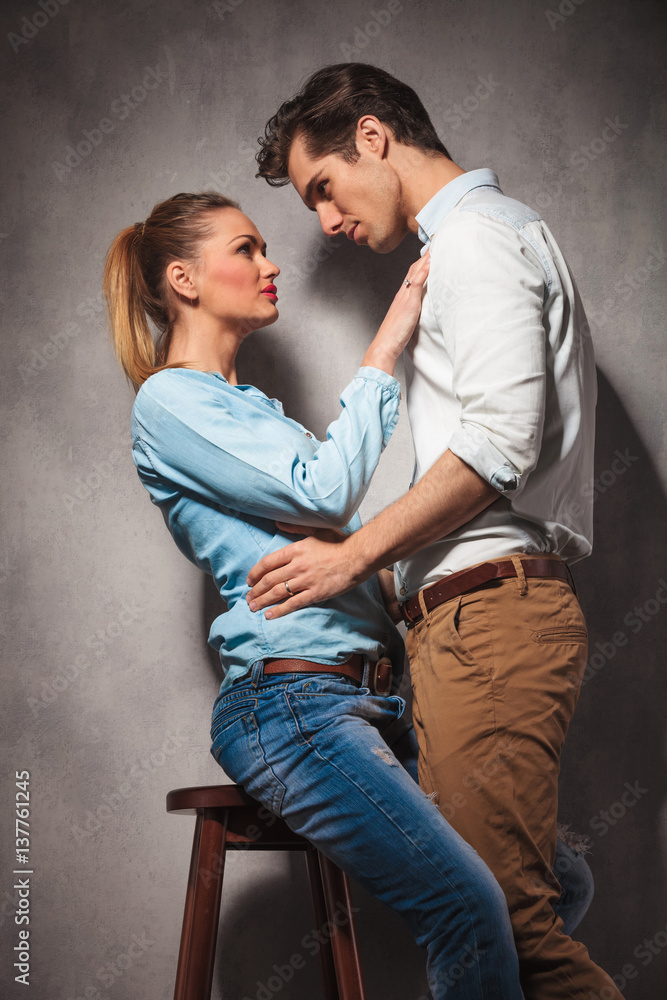 in love couple , woman sitting and man standing in love couple , woman sitting and man standing