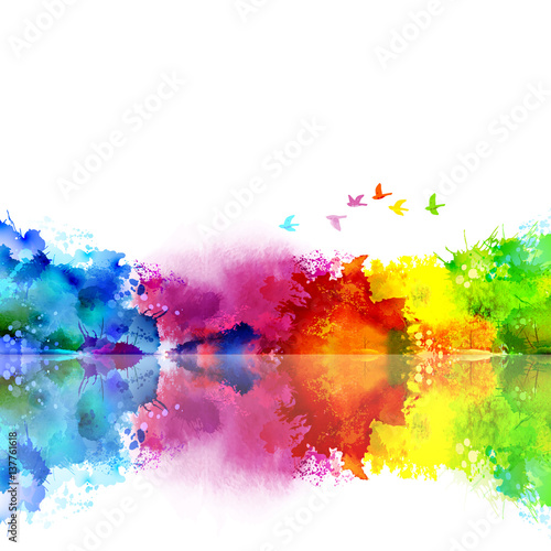 Abstract Watercolor fantastic landscape with a flying flock of birds. Calm lake, trees and shore created colored blotches and spots.