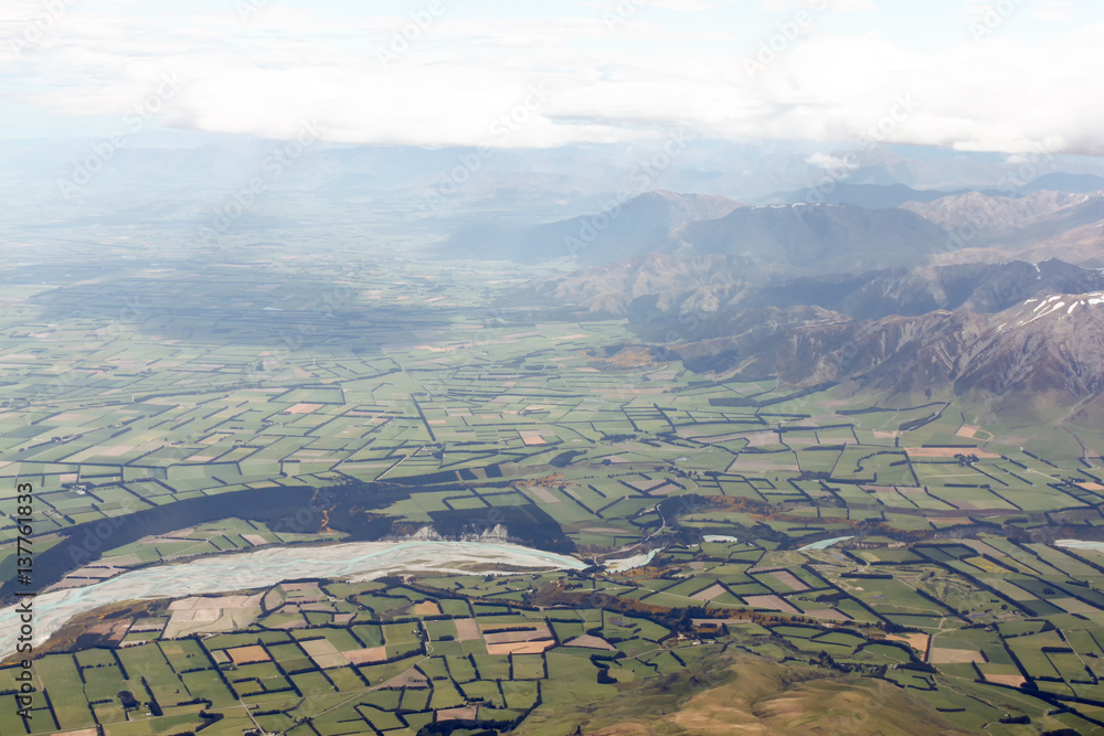 Aerial photo of landscape around Christchurch, New Zealand, South Island,  taken from airplane before landing to Christchurch.