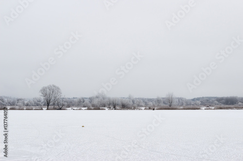 White winter landscape frozen lake in the forest © madredus